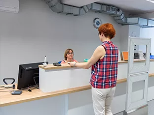 Visually impaired woman using magnifier