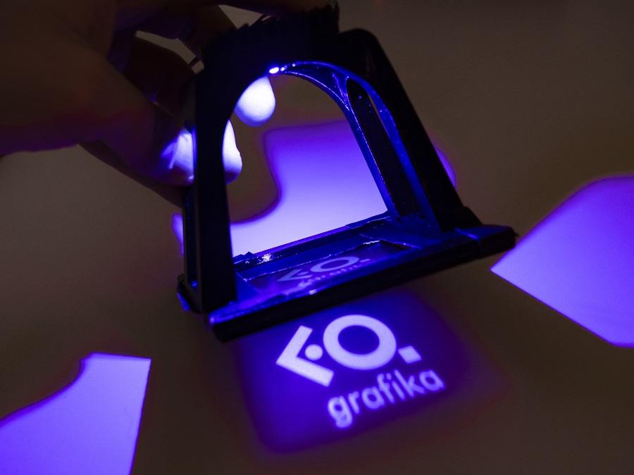 Logo of the Department of Graphic Design exposed to UV light
