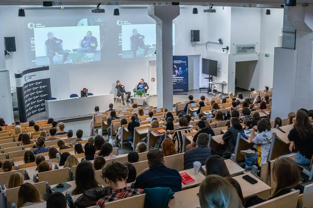 Photo of the room from above, you can see the audience and invited guests