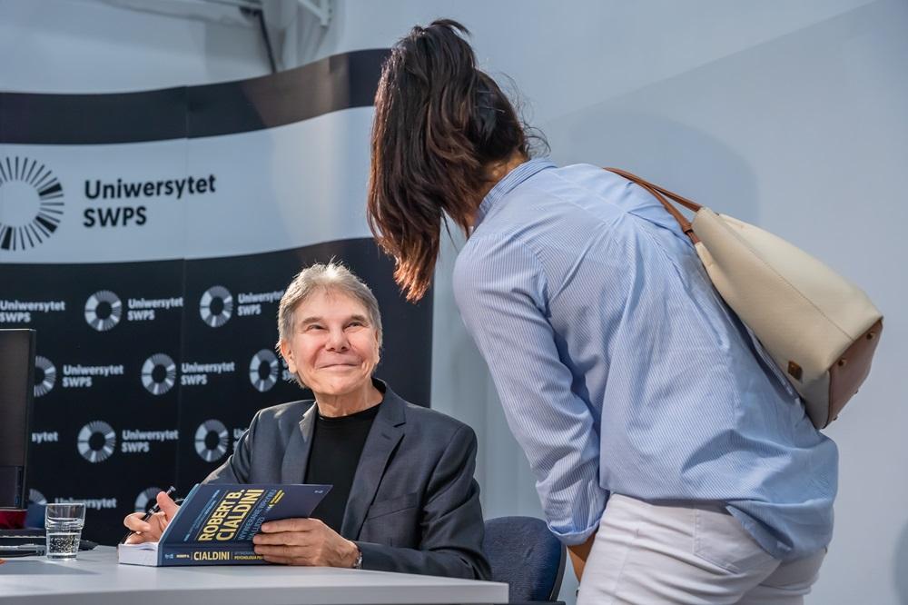 Professor Caldini signing his book for a student