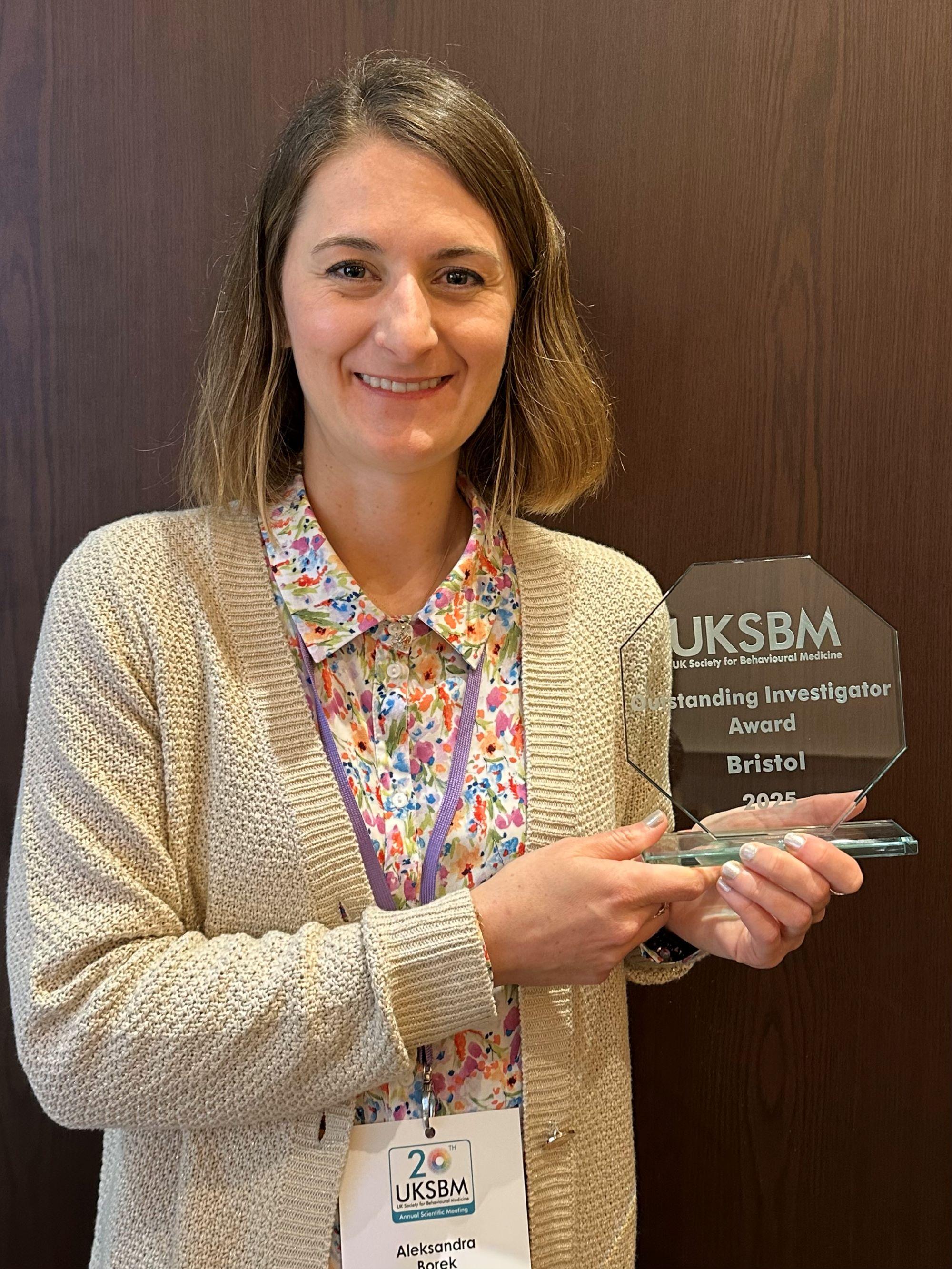 Dr. Aleksandra Borek with the UKSBM Outstanding Investigator Award