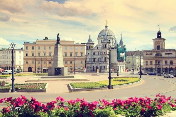 Photo of a roundabout and historical buildings in Plac Wolności in the city of Łódź, Poland
