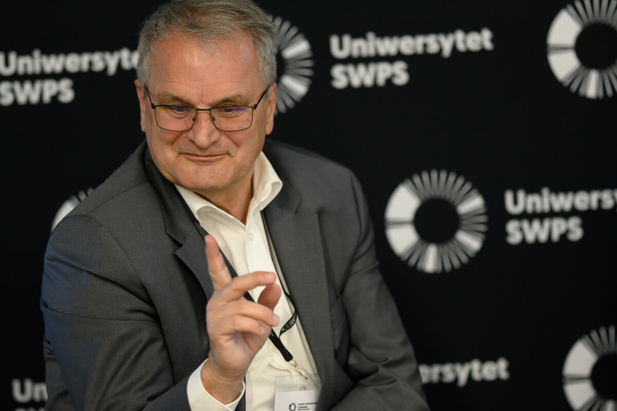 Professor Wolfgang Koenig speaking at a conference on social innovation and quality of life at SWPS University